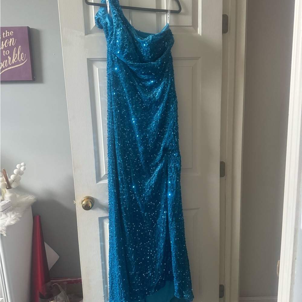 Beautiful beaded maxi dress with  long mermaid hem.  Never worn.